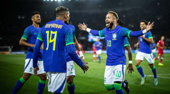 Brazil celebrating a goal vs. Tunisia.